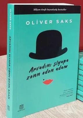 An image of a product called Arvadını şlyapa zənn edən adam
